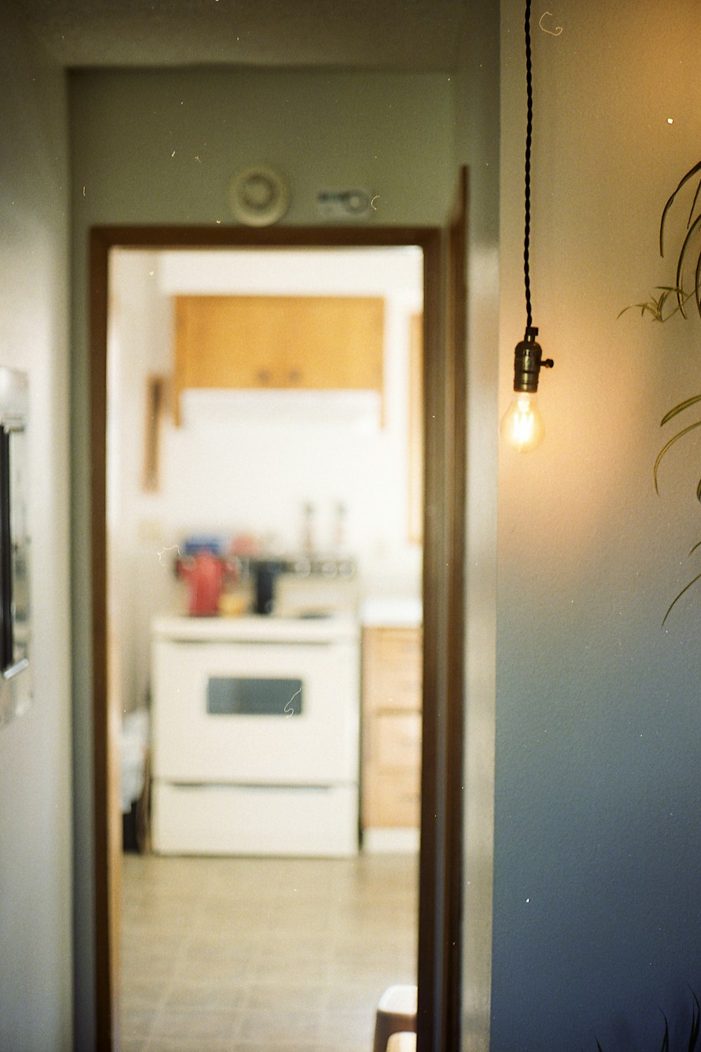 white pendant lamp lighted inside the house