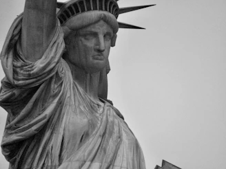 Close-up of the blindfolded Greek-Roman goddess of justice statue symbolizing fairness.