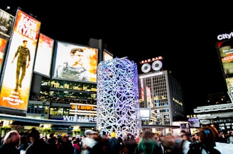 people near buildings during nighttime