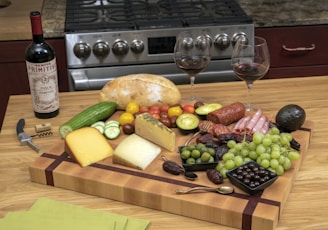 Warm kitchen scene with Spanish olive oil, gourmet preserves, and spices artfully arranged on a rustic wooden table.