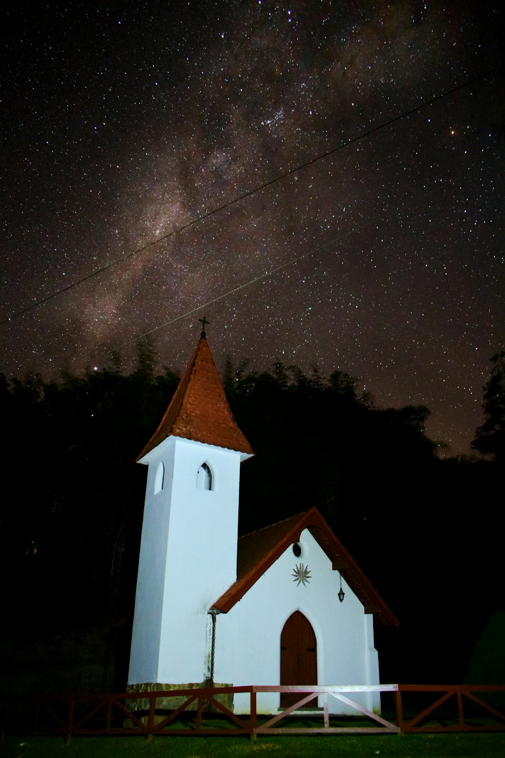 white and brown house during nighttime