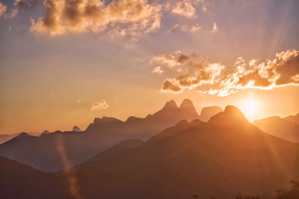 silhouette of mountains during golden hour