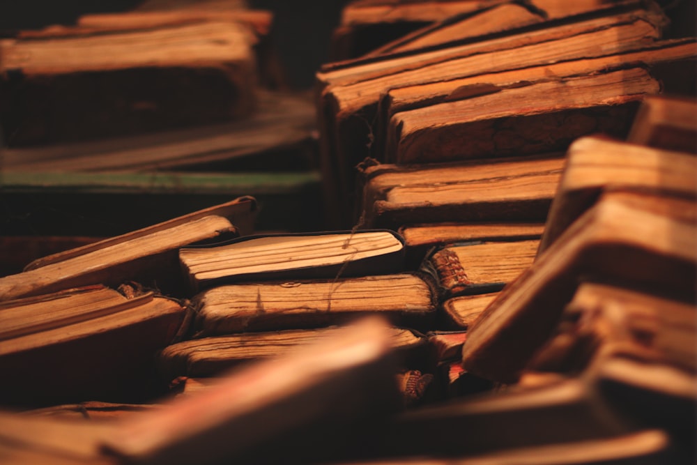 a pile of old books sitting next to each other