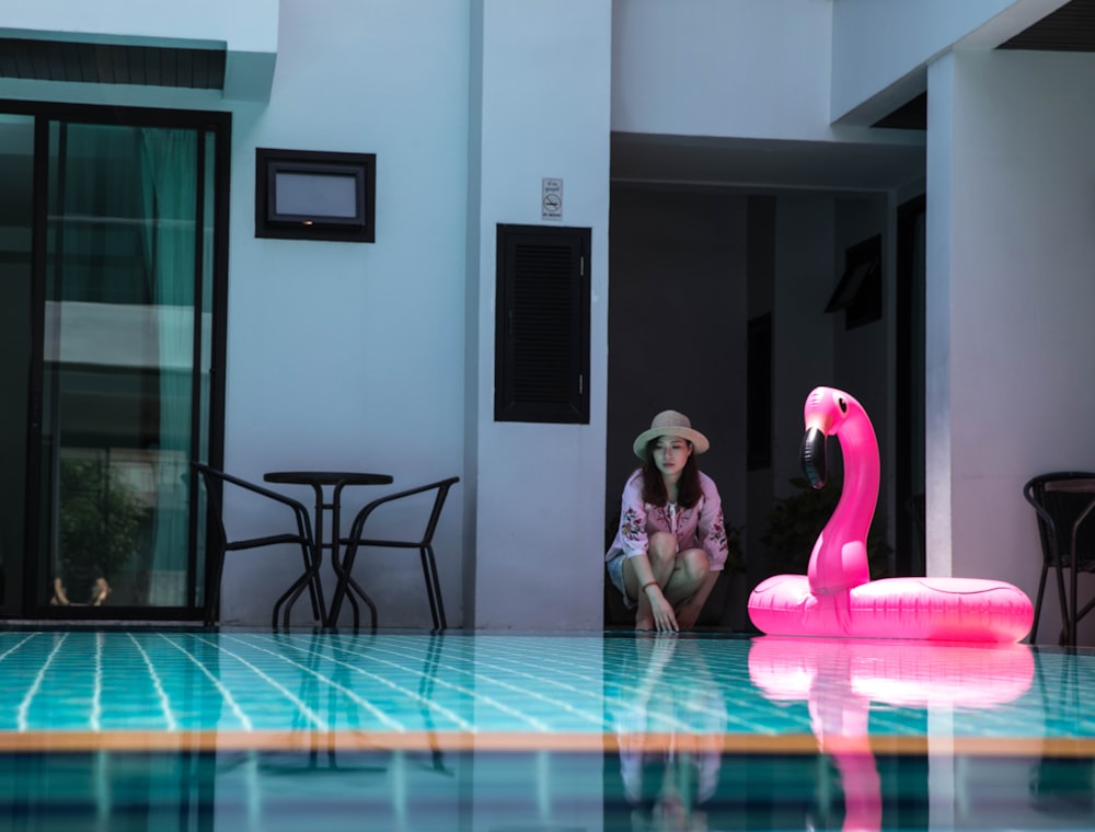 flamingo inflatable tube on swimming pool