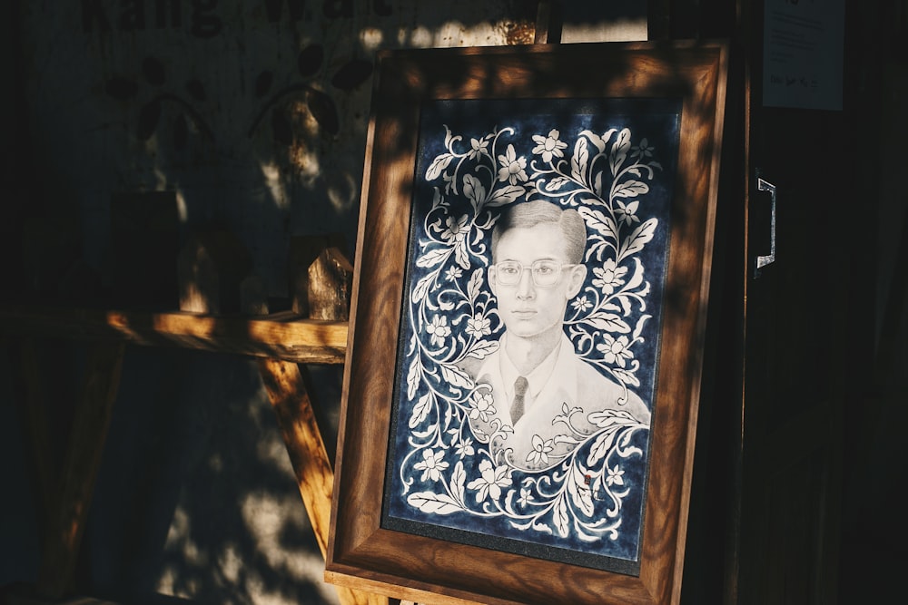 brown wooden framed woman portrait