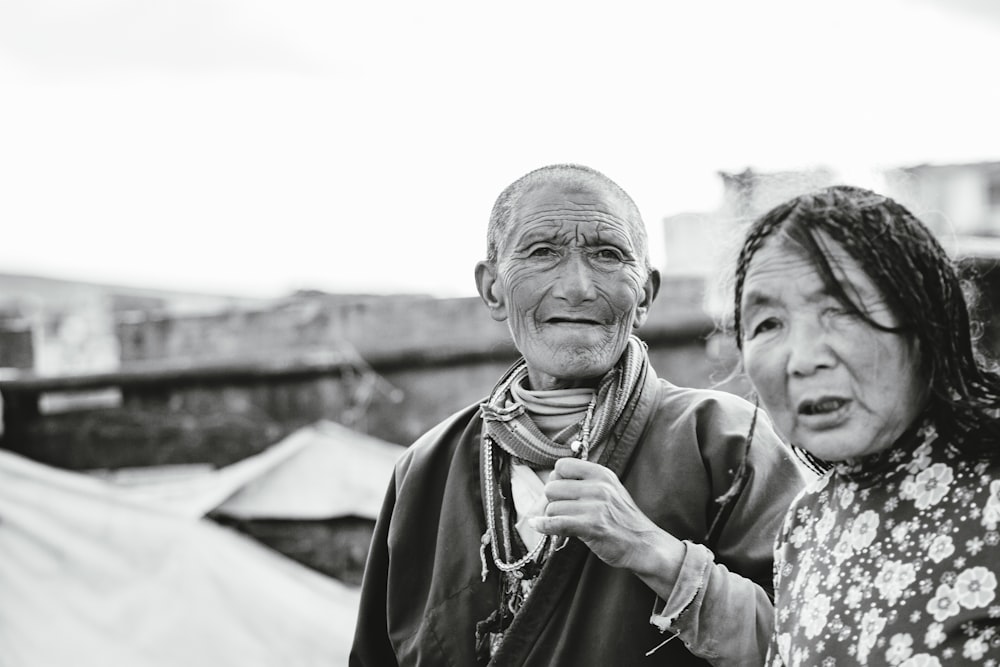 grayscale photo of man and woman