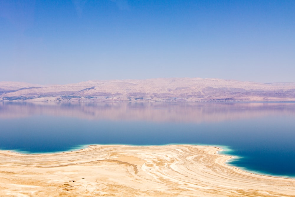 body of water during daytime digital wallpaper