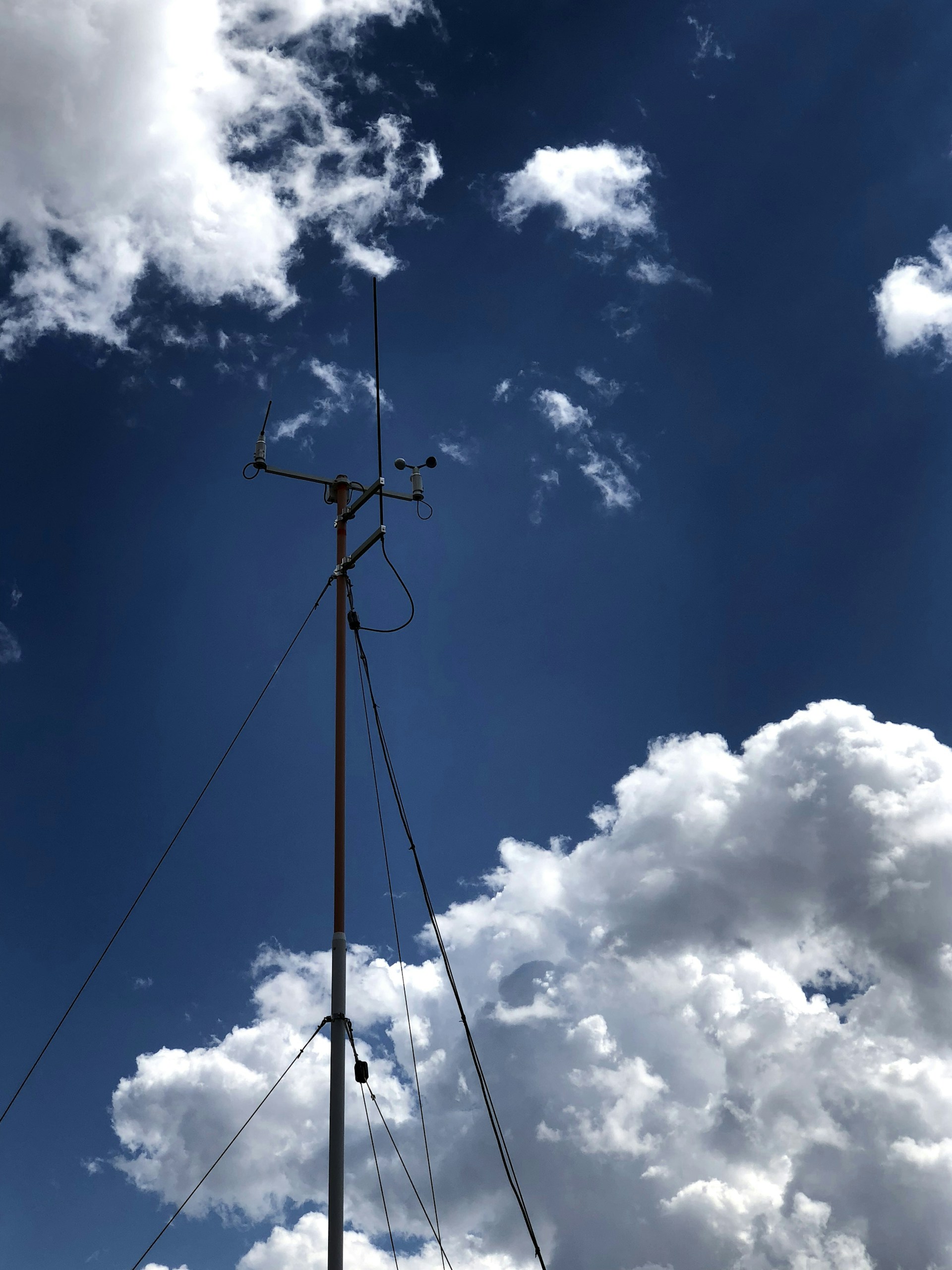 woman wearing yellow long-sleeved dress under white clouds and blue sky during daytime