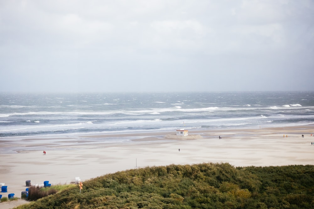 waves hitting the shore during cloudy day