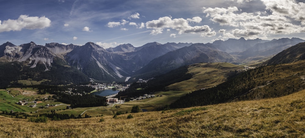 landscape photo of mountains under cloudy sky during daytime