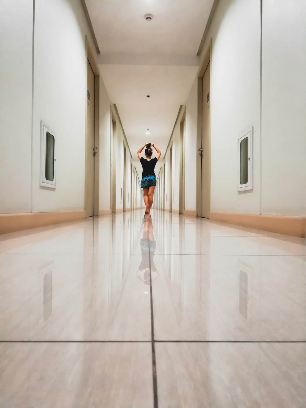 woman walking along alley