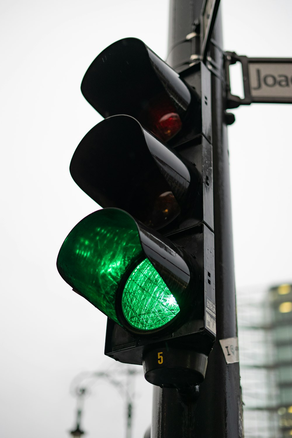 black traffic light on go signal