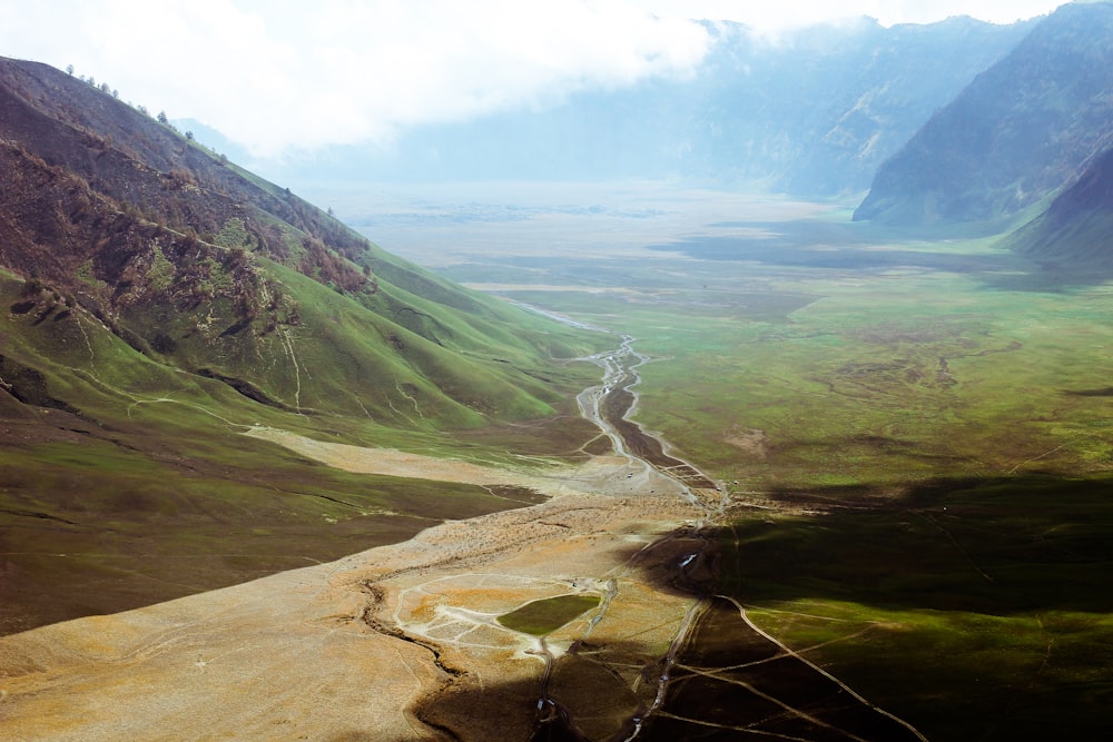 pathway between mountains during daytime