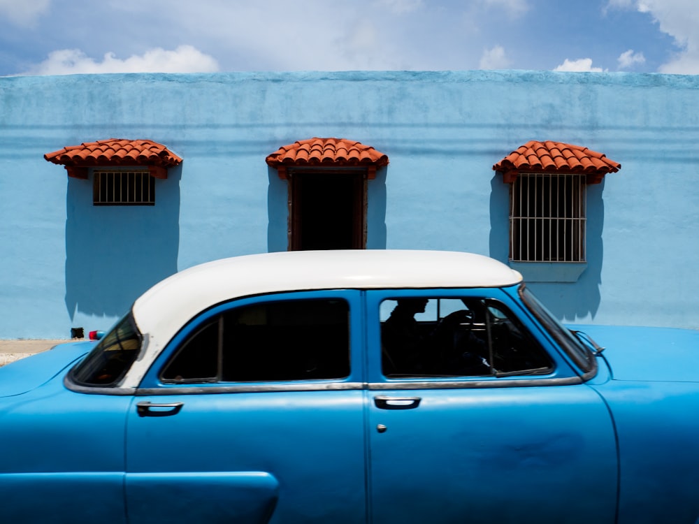 blue and white sedan during daytime