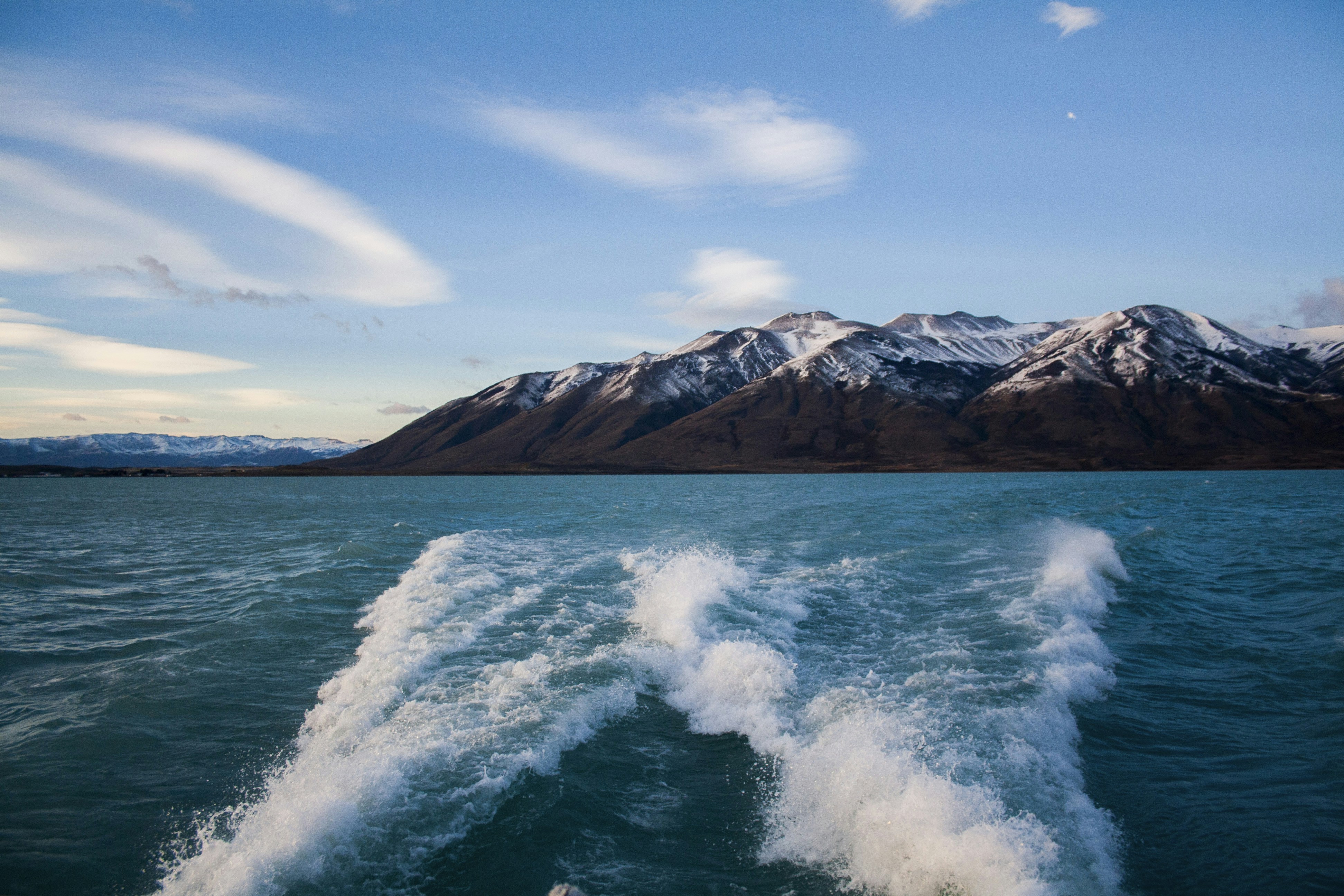 mountain surrounded by body of water