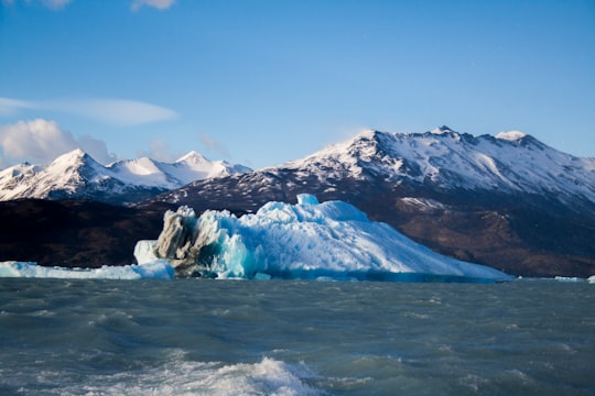 body of water near mountain at daytime in Argentino Lake Argentina