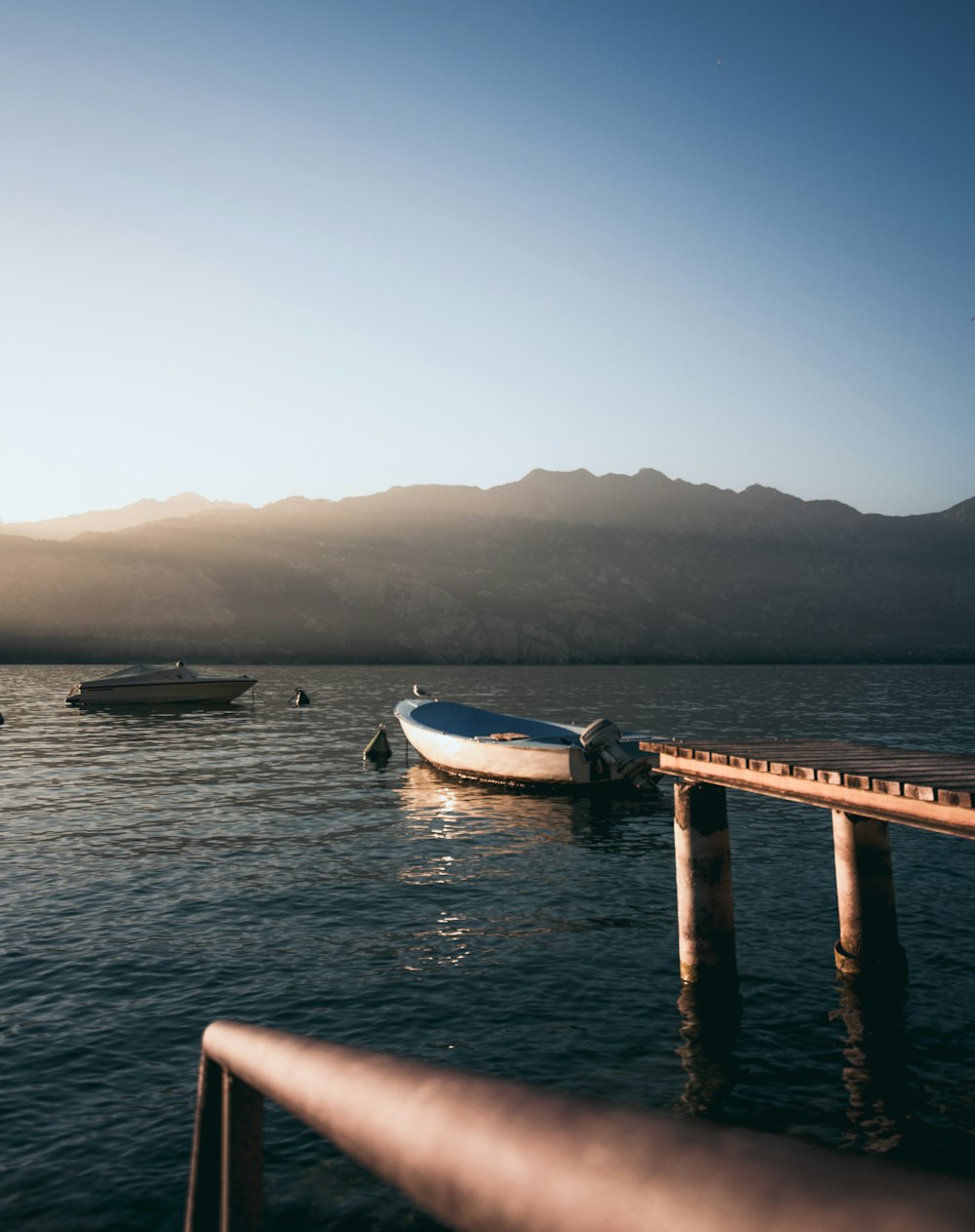 two motor boats on body of water during daytime