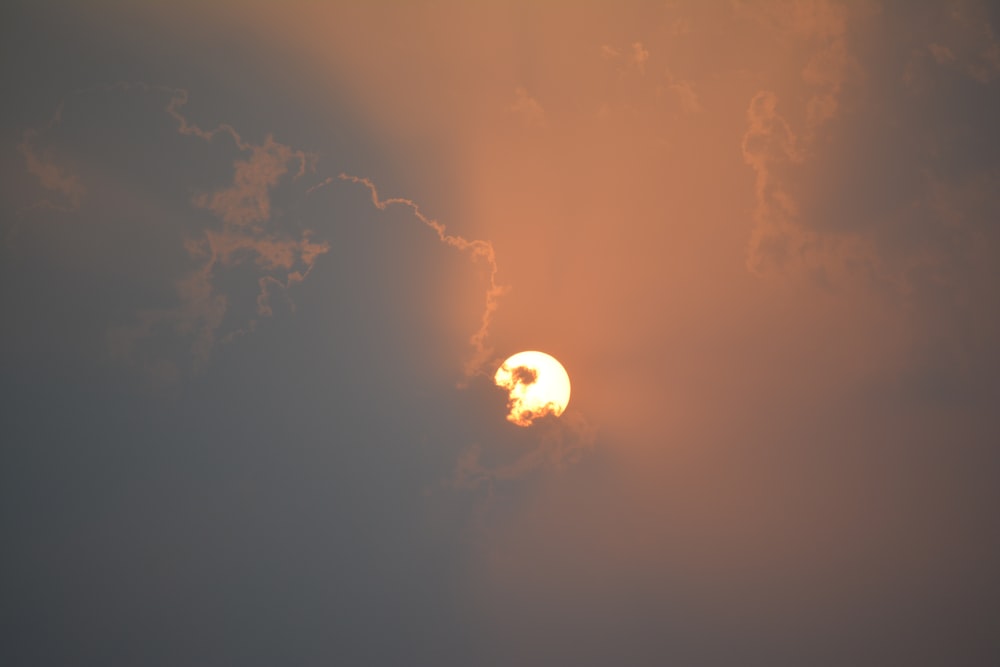yellow moon covered with clouds