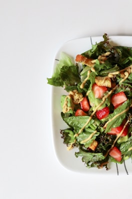 A colorful salad featuring fresh greens and gentle dressing.