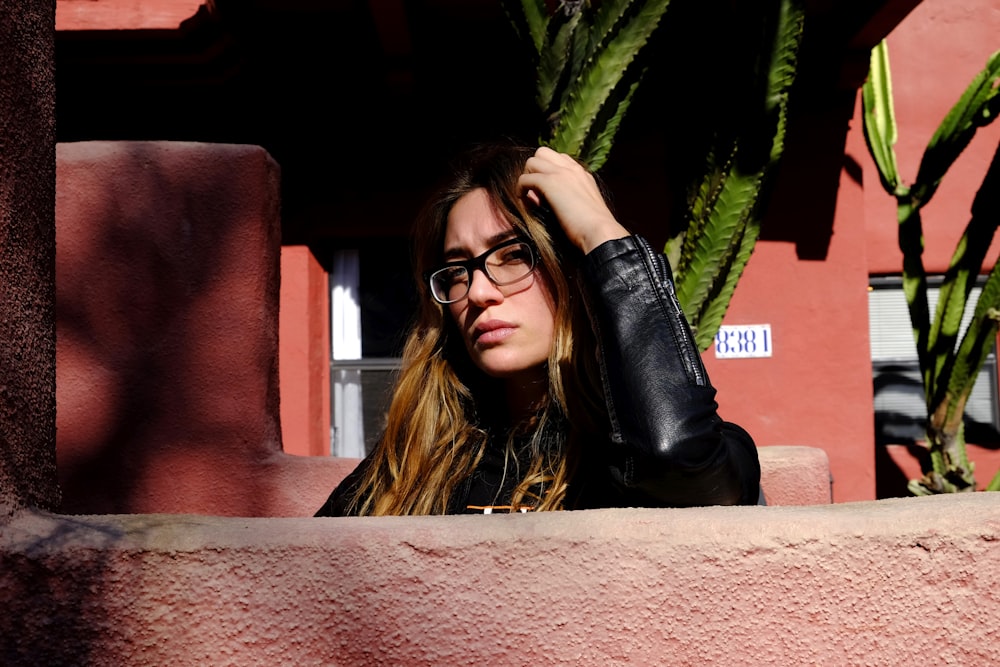 woman wearing black leather jacket