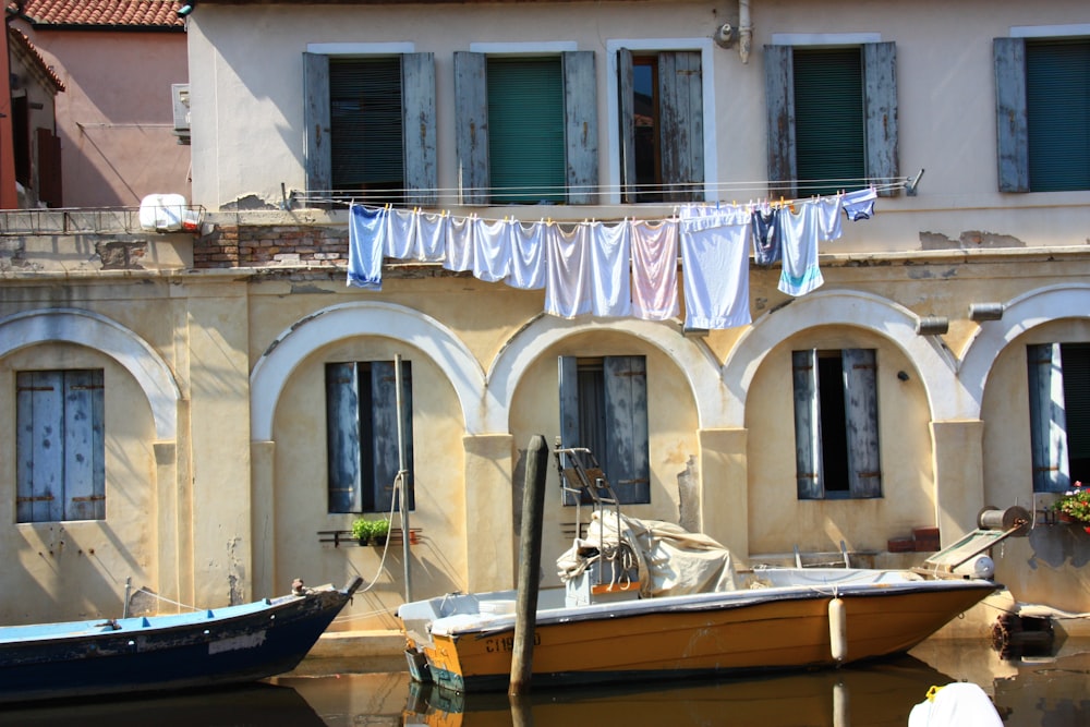 assorted-colored clothes hanging on string