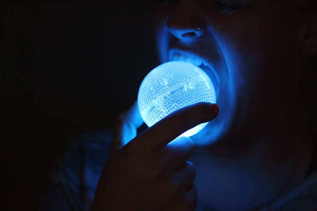 person about to eat blue LED light ball