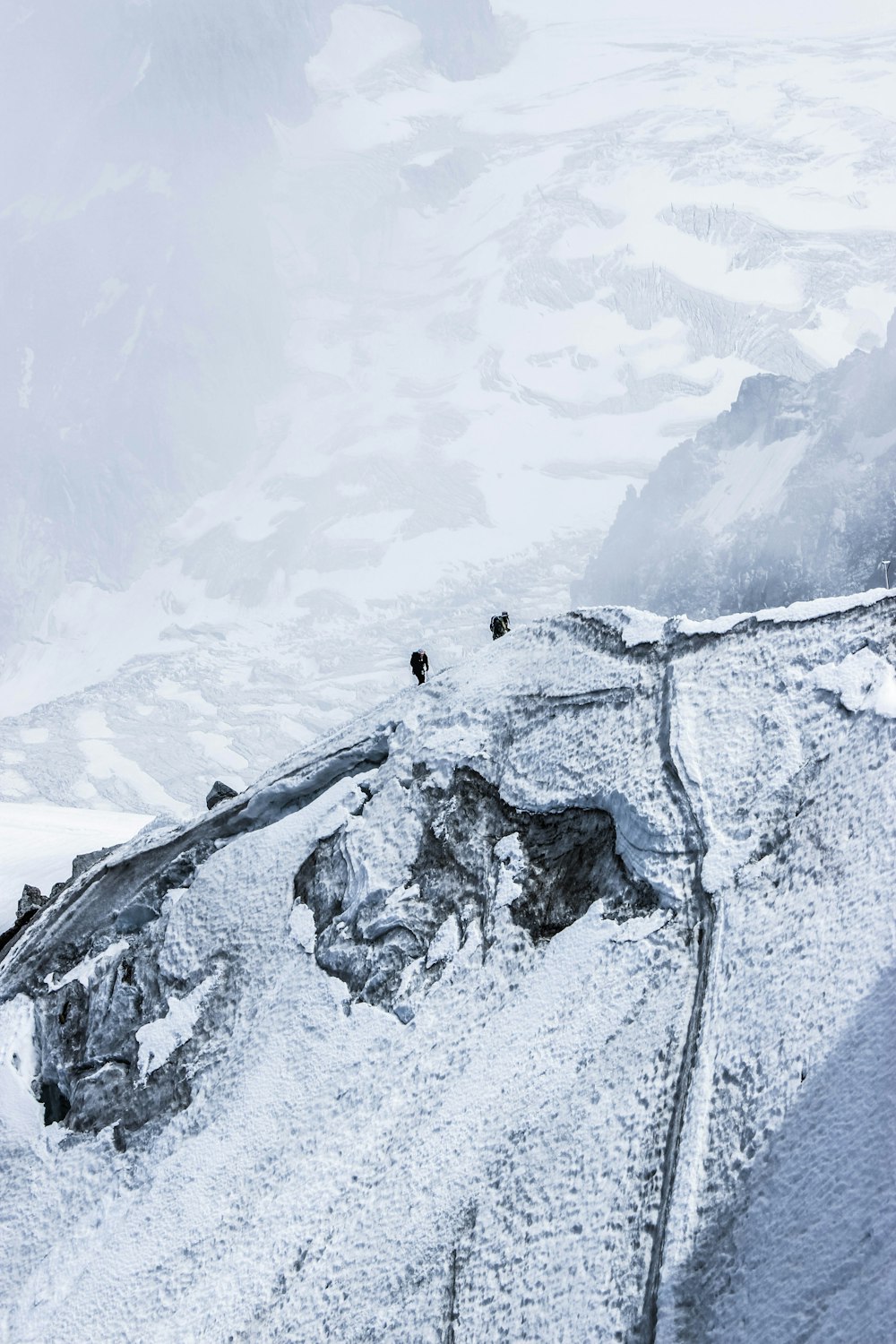 low-angle photography of snow-covered mountain during daytime