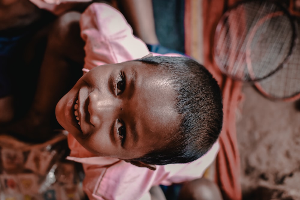 selective photography of a boy smiling