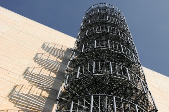 gray metal spiral staircase near white wall in Frankfurt Germany