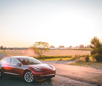 red sedan on road