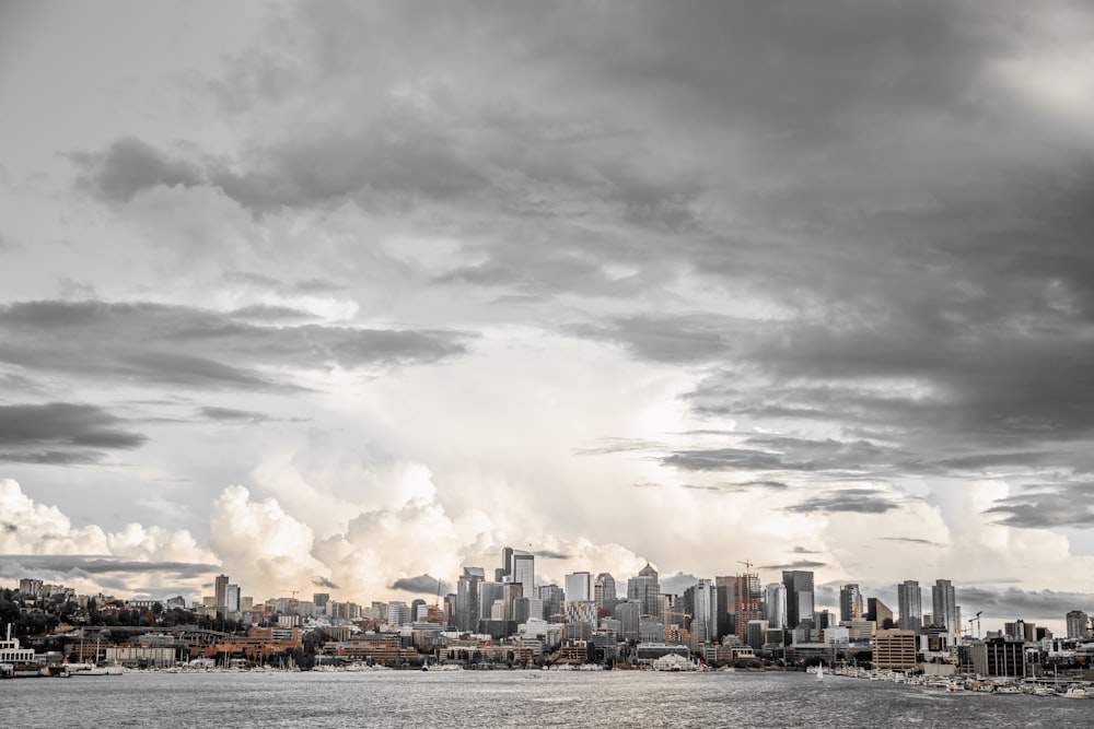 city buildings under gray cloudy sky