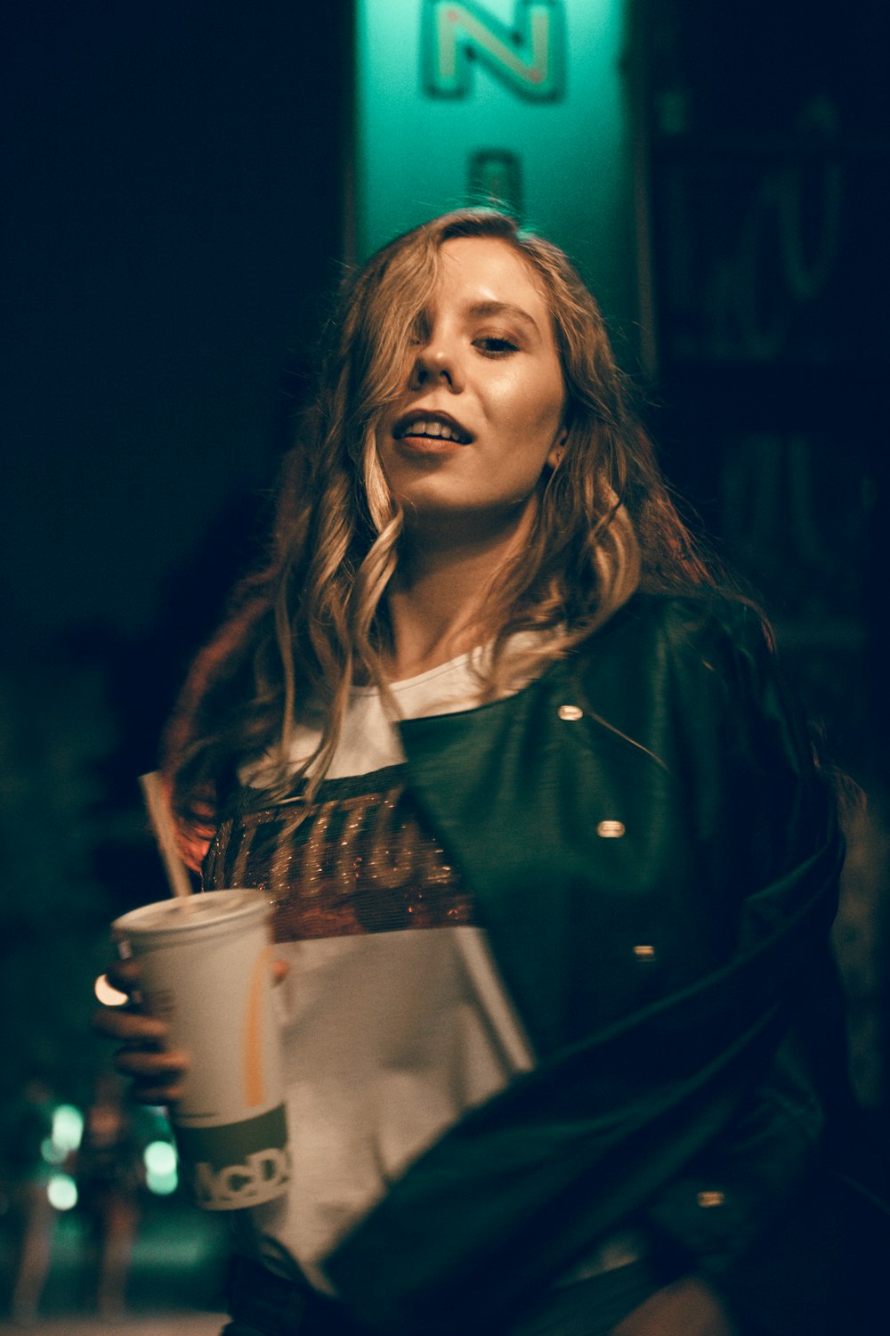 woman holding McDonald's cup