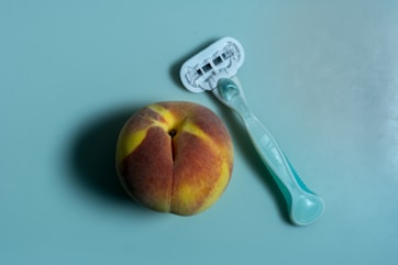 whole brown apple fruit and trimmer