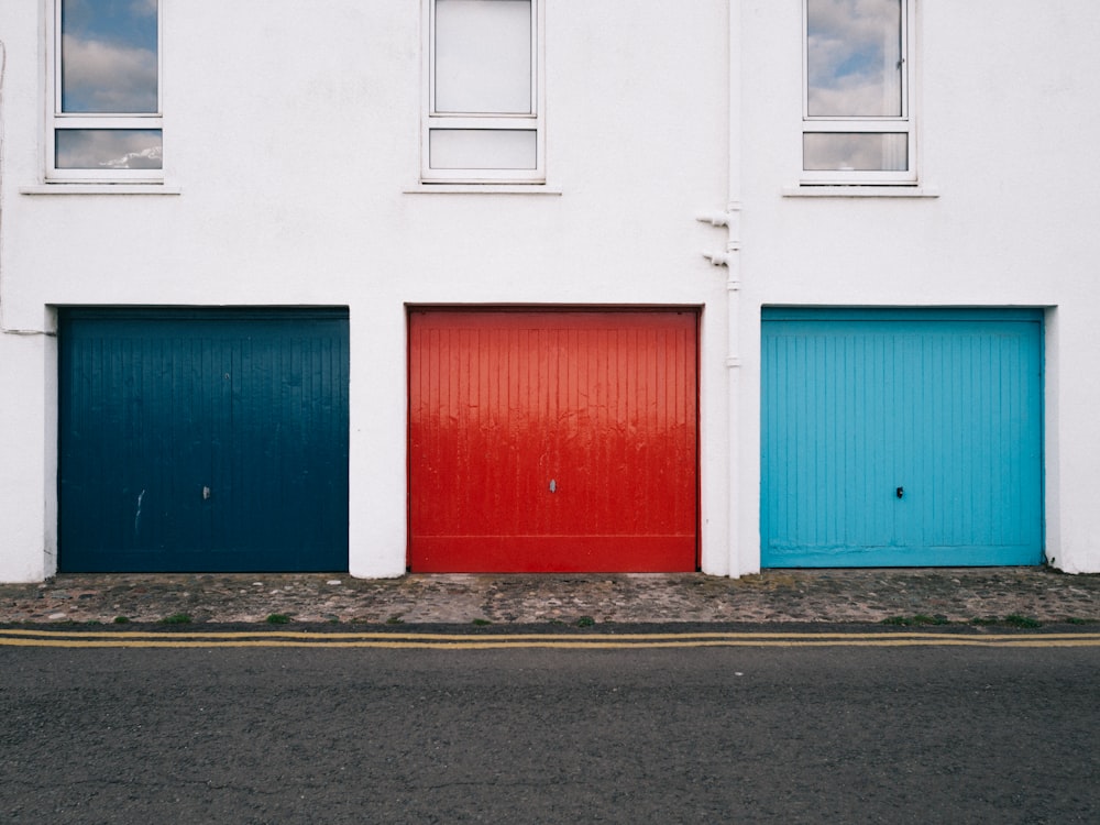 blue shutter door beside rroad