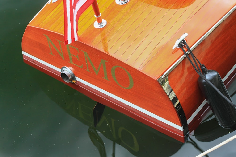 brown bass boat on body of water during daytime