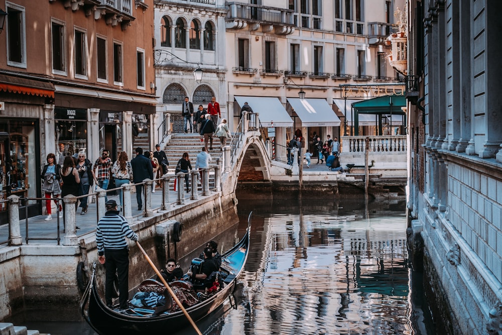 people walking near body of water during daytime