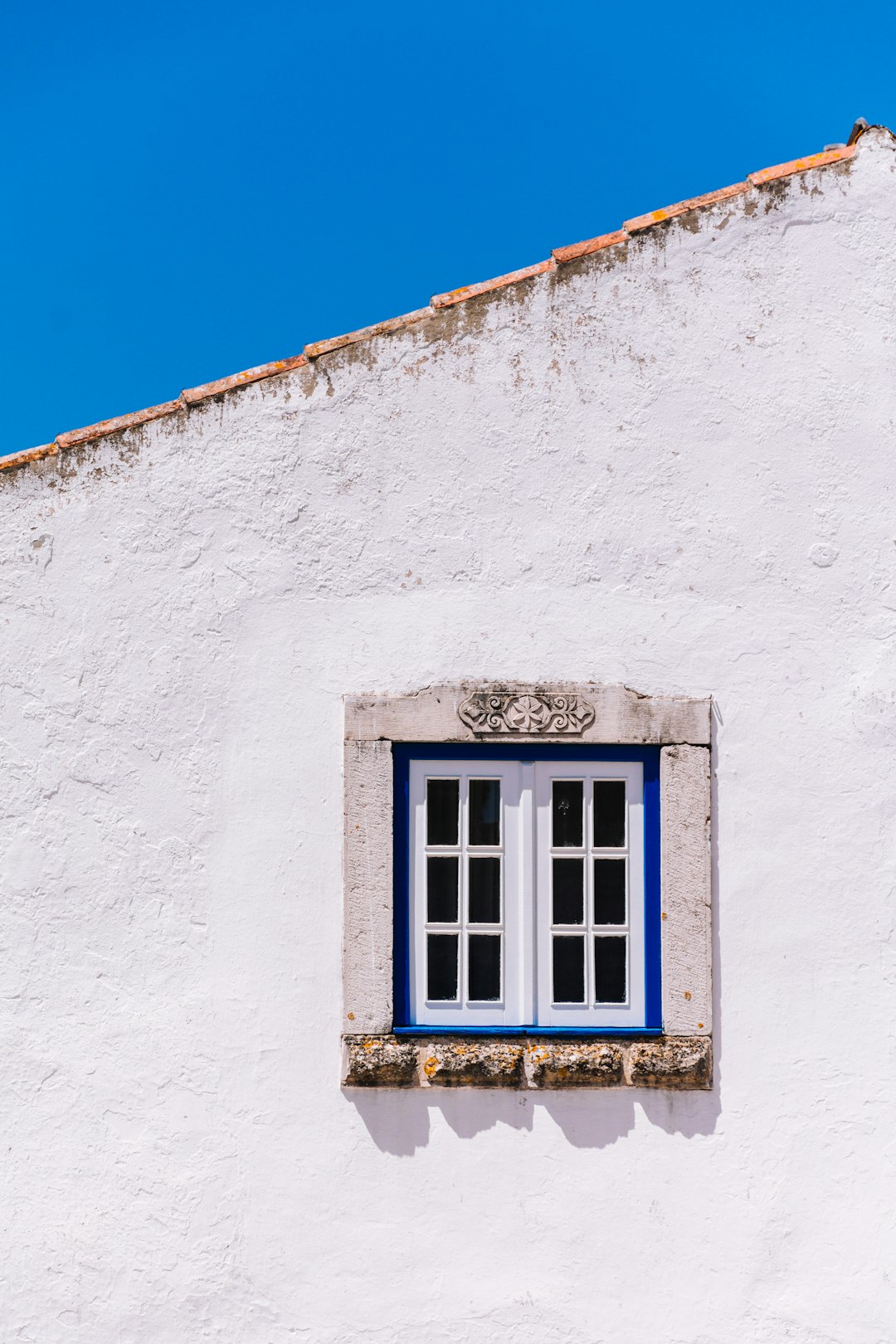 house with white wooden window