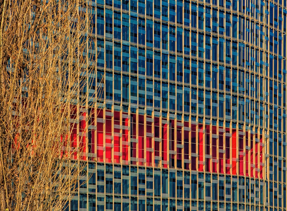 a tall building with a red sign on the side of it