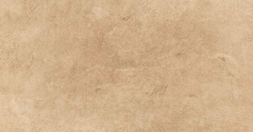a beige background with a rough texture