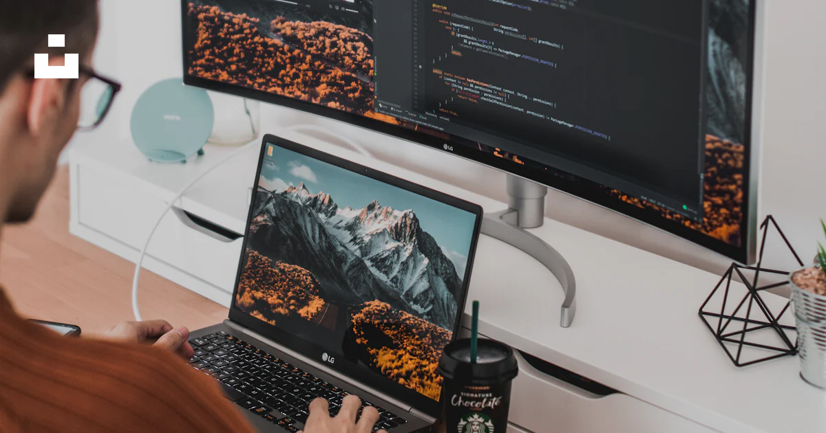 Unsplash Main Using Computer Man using laptop and computer monitor photo – Free Timișoara Image on ...