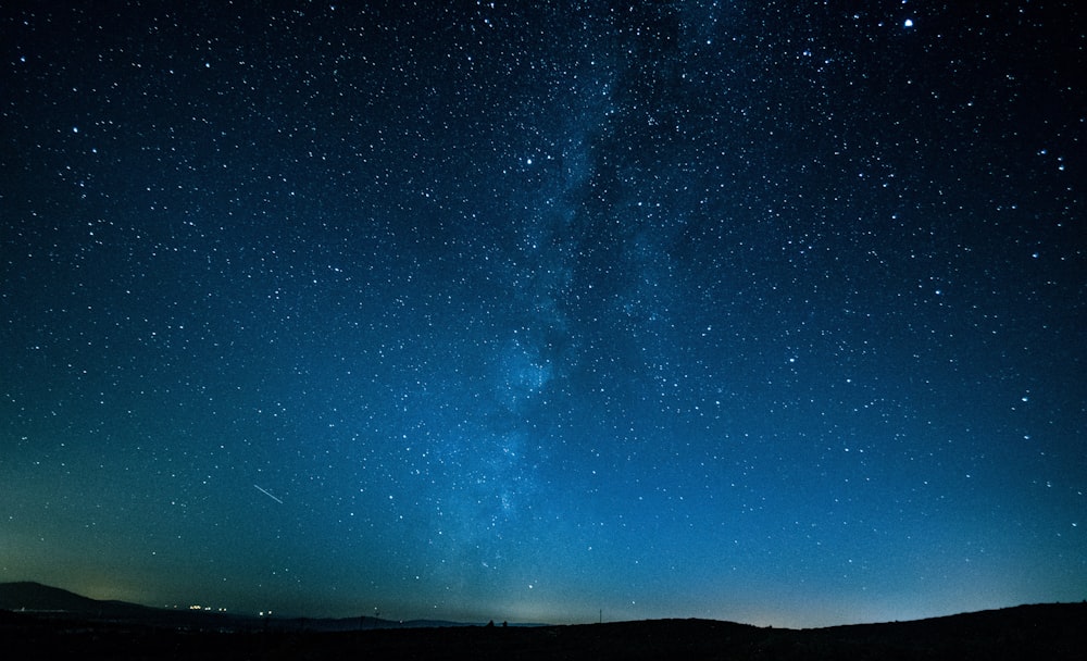 mountains under starry sky