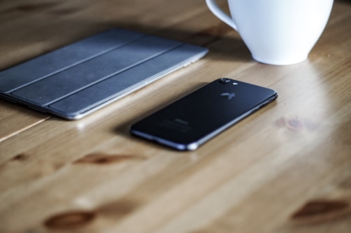 Rdp's portfolio displayed on a tablet resting on a wooden table with soft natural light.