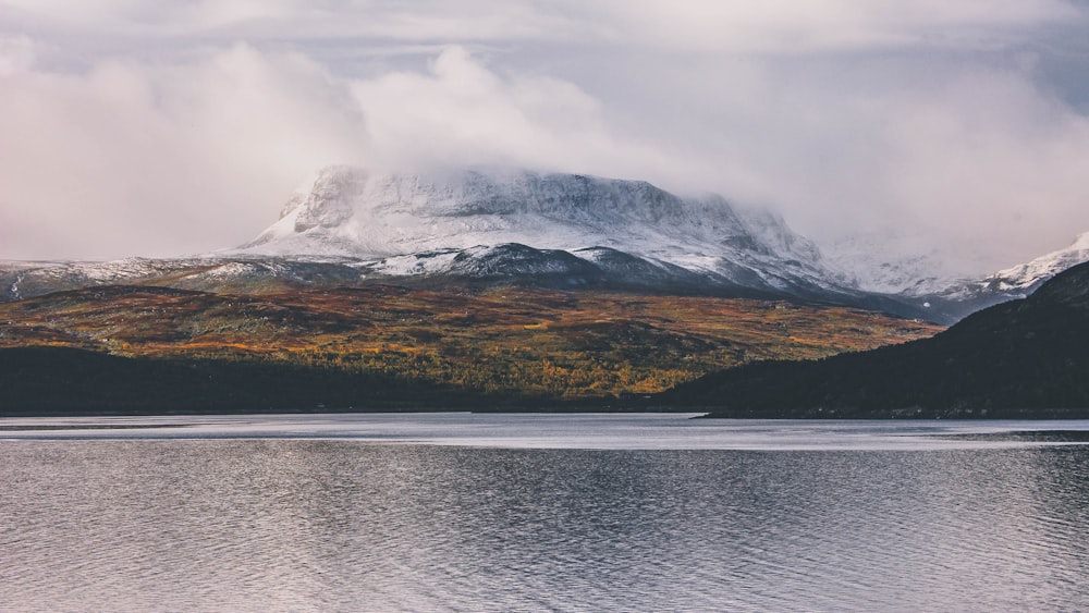 body of water near mountain