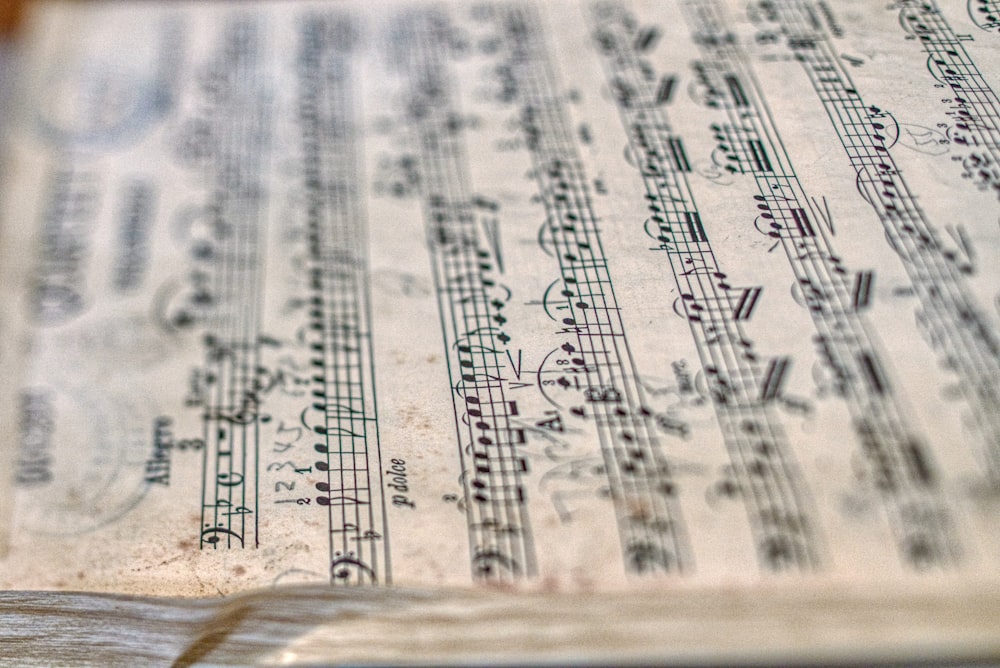 selective focus photography of 2 flats music sheet