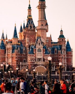 Players gathered around a giant Minecraft castle during a lively server event.