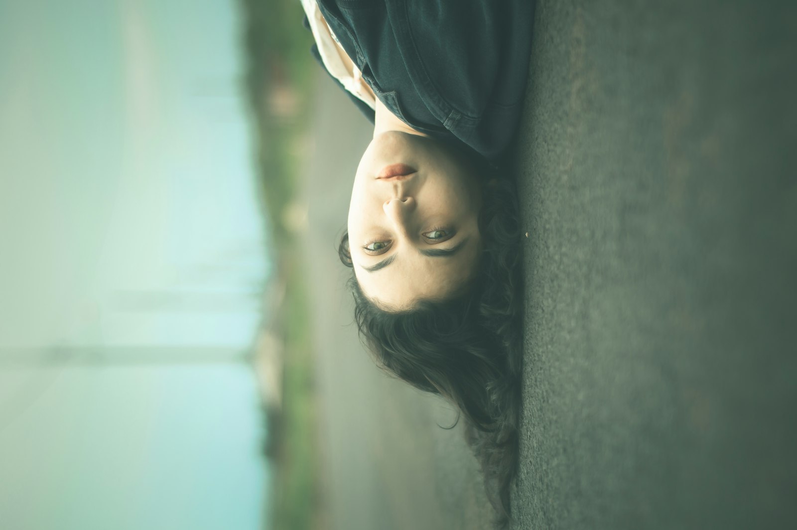 Nikon D3200 + Nikon AF Nikkor 50mm F1.8D sample photo. Woman lying on road photography