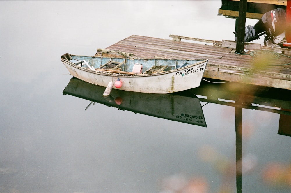 white boat near dock