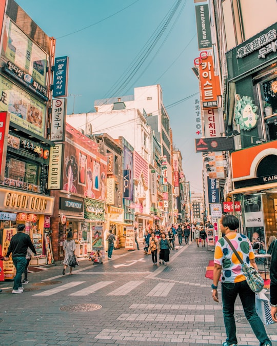 people walking on road surrounded by buildings in Myeongdong 2(i)-ga South Korea