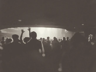 Color photograph of a packed auditorium during an important event in his career.