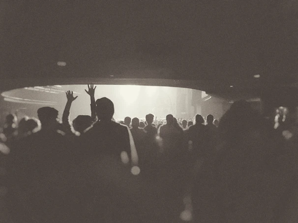 Color photograph of a packed auditorium during an important event in his career.